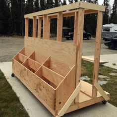 a wooden structure sitting on top of a sidewalk