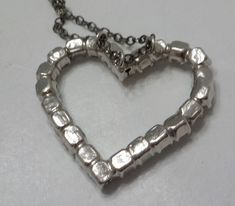 "Vintage silver tone heart pendant necklace. 1\" x 1\" heart is loaded with clear, faceted, and prong set rhinestones, all of which are present and intact. Very sparkly! Sterling chain is gorgeous! Unsigned." Metal Heart Cut Necklace For Anniversary, Silver Heart Necklace With Box Chain, Silver Heart Pendant Necklace With Box Chain, Metal Heart Necklace For Anniversary, Funky Necklace, Unicorn Pendant, Sweater Clip, Pearl Pendant Necklace, Glass Bead Necklace