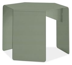 a small green table with an open end section on the top and bottom, in front of a white background