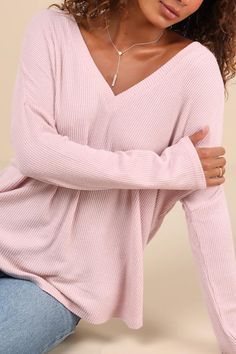 The Lulus Just Vibing Blush Pink Ribbed V-Neck Sweater Top is prepared for just about anything! This soft, lightweight ribbed knit top has a V-neckline, long sleeves with drop shoulders, and a relaxed, wide-cut bodice with a rounded hem. Pair with cropped denim and your favorite sneakers for a chic and minimalist look! Fit: This garment fits true to size. Length: Size medium measures 26.5" from shoulder to hem. Bust: Great for any cup size. Waist: Not Fitted - comfortable room throughout midsect Women’s Tops, Pink Ribbed, Ribbed Knit Top, Comfortable Room, Knit Tops, Cup Size, Cropped Denim, V Neck Sweater, Soft Knits