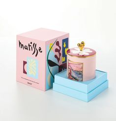 a pink and blue box with a flower on top