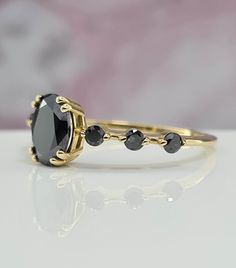 Everyday Wear Amazing Handmade Black Gold Ring For Her. 1 Carat Oval Black Gem Amazing Handmade Gold Ring For Her Black Gold Ring, ring For Her, Amazing gold ring, Handmade ring. Setting Options (Choose & Checkout) White, Rose or Yellow Gold 14k or 18k 4-14 US for your choice Center Stone: Oval Cut 7.50 x 5.50 mm Carat weight: 1.01 ct Color: Black Clarity: AAA Cut: Excellent Natural Spinel Setting: 4 Prongs Gemological Certificate  Side Stone: 6 Diamonds Carat weight:: 0.18 ct Color: Black Clarity: AAA Cut: Excellent Band Details: 1.50 mm thickness: 1.40 mm width Why ∙ It's ∙ Awesome ✓ Gemological Certificate  ✓ 20 Years of Experience ✓ 100% Original Designs ✓ Conflict-Free Diamonds & Gemstones ✓ Free USA Shipping ✓ Custom Orders ✓ Contact us for special request Easy Payment Option: You ca Handmade Gold Ring, Black Gold Ring, Black Engagement Ring, Black Stone Ring, Black Gems, Black Diamond Ring, Shape Art, Schwarz Gold, Ring Oval