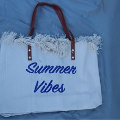 New With Tags Great Tote Size White Bag With Summer Vibes Embroidered In Navy Blue Material: Canvas Snap Closure 18.9 In (L) X 4.33 In (W) X 13.39 In (H) White Canvas Bag For Vacation, Summer Weekend Tote Shoulder Bag, Summer Weekend Tote Bag, Cream Canvas Bag For Summer Vacation, White Canvas Bag For Summer Vacation, White Weekend Shoulder Bag, Casual Embroidered Beach Bag, White Large Capacity Shoulder Bag For Weekend, White Shoulder Bag For Weekend