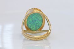 GREEN OPAL RING, Opal Gold Ring, Gemstone ring, October Birthstone, Opal Emerald lawn Gold Filled Ring, Fire Opal jewelry, Opal Big Ring Statement green opal ring made of 14k gold filled the stone is 13*18 mm , it is a perfect to give as a gift for woman Measurements: Size- available all size The center stone is 18mmx13mm Gemstone is a lab opal The ring will be packed in a gift box. FOR MY RINGS COLLECTION HERE: https://www.etsy.com/il-en/shop/rebekajewelry?section_id=14282915&ref=shopsectio Elegant Green Cabochon Opal Ring, Fine Jewelry Green Opal Ring For Formal Occasions, Green Opal Gemstone Ring For Formal Occasions, Fine Jewelry Green Opal Ring, Green Oval Opal Ring For Formal Occasions, Formal Green Opal Gemstone Ring, Formal Green Opal Ring, Green Cabochon Rings Fine Jewelry, Hallmarked Green Opal Ring In Fine Jewelry Style