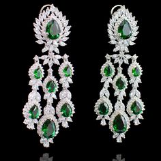 Our Irina Set has that classic vintage appeal but with a contemporary spin! Gleaming emerald and CZ stones make this set a must-have for an ultra-glamorous dose of shine. Approximate earrings length is 4". This set is available in 2 options: Necklace + Earrings Necklace + Earrings + Teekah Please select the desired option at the time of purchase. Silver-plated on high-quality brass as base metal. Made by order. Kindly allow 5-7 weeks for the delivery of this item. For custom or urgent requests,