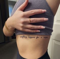 a woman's stomach with the words everything happens for a reason written on it