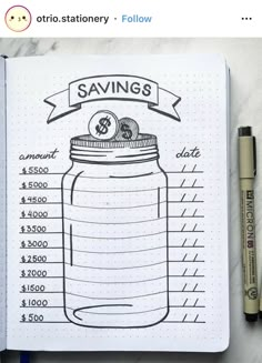 a notebook with a drawing of a jar on it and the words savings written below