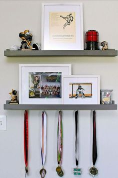 two shelves with medals and pictures on them