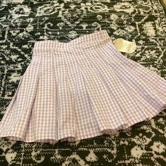 Stretchy Pleated Tennis Skirt In White And Purple Gingham Summer School Plaid Skirt, Fitted Plaid Mini Skirt For Spring, Summer Plaid Mini Tennis Skirt, Plaid Mini Tennis Skirt For Summer, Summer Plaid Pleated Skort, Plaid Mini Skirt For Spring, Summer Pleated Plaid Skort, Plaid Pleated Skort For Summer, Summer Plaid Mini Pleated Skirt