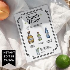 an image of a bottle of alcohol next to two limes and peaches on a white cloth