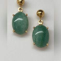 There Is A 5mm Gold Ball At The Top Of The Earring With A Stud Post For Pierced Ears. Swinging From A Small Ring At The Bottom Of The Gold Ball Is A Large Cabochon Cut Jade Gemstone. The Jade Is Set In A Simple But Very Strong 4 Prong Basket. The Gemstone Measures 14 X 10mm. It Has A Rounded Smooth Top And Flat Bottom. A Mix Of Medium Green With Flecks Of Light And Darker Greens Throughout. These Earrings Measure 15/16" From Top To Bottom. They Have Quite A Bit Of Weight With A Good Amount Of Gold, 4.1 Grams! They Are Missing One Of The Push Backings But It Is Easily Replaceable/Interchangeable If You Have Another Pair. They Are Solid Yellow Gold And Have Been Tested And Are Stamped 14k On T Small Ring, Jade Gemstone, Small Rings, Earrings Color, Pierced Ears, Solid Yellow, Womens Jewelry Bracelets, Ear Piercings, Light In The Dark