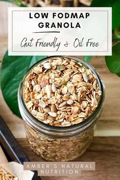 a jar filled with granola sitting on top of a wooden table