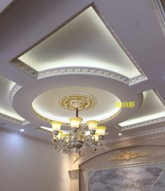 the ceiling is decorated with chandeliers and lights in an elegant style, but not very expensive