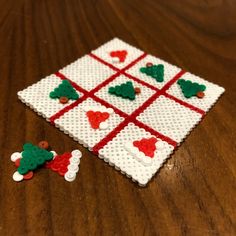 a close up of a game on a wooden table with pieces missing from the board