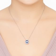 Add a touch of elegance to any outfit with our Tatiana Oval Tanzanite Pendant Necklace. This necklace boasts a stunning lab-created Tanzanite, oval in shape, that exudes a captivating blue hue. It's beautifully framed by sparkling cubic zirconia, adding an extra shimmer to its allure. The pendant hangs gracefully on a fine chain, making it versatile for various necklines. And for those who love a coordinated look, we've got you covered with matching cocktail rings and earrings. Make a statement with the Tatiana Necklace – where style meets sophistication. Handcrafted in 925 Sterling Silver. Lab-created Tanzanite. Cubic Zirconia.  Packaging:  This item is presented in Latelita London signature packaging.  Care Instructions:  To maintain your jewellery, wipe gently with a damp cloth that is Elegant Sapphire Oval Pendant Necklace, Elegant Sapphire Necklace With Oval Pendant, Sapphire Necklace With Oval Halo Setting, Elegant Oval Pendant Necklace With Birthstone, Oval Sapphire Jewelry With Halo, Oval Sapphire Necklace With Halo Setting, Oval Sapphire Halo Jewelry, Sapphire Oval Pendant Necklace For Weddings, Oval Sapphire Necklace For Anniversary