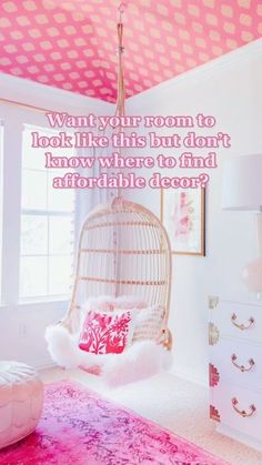 a bedroom with pink and white decor, including a hanging chair in the middle of the room