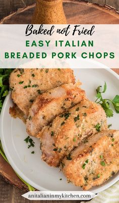 breaded pork chops on a plate with parsley