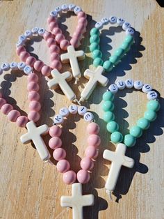 These handmade mini personalized rosaries are a perfect gift for the little loved ones at your special occassion as a keepsake!  Each rosary is made using 8mm coated glass beads and 7mm letter beads, 20x30mm howlite stone cross and nylon thread  Please add name for personalization You can order 1 or scroll down in quantity for discounted bulk orders Personalized Pink Rosary Bracelet For Baptism, Pink Cross Rosary Bracelet Gift, Pink Cross-shaped Rosary Bracelet Gift, Mini Rosaries, Personalized Rosary, Gift For Students, Stone Cross, Christening Favors, Howlite Stone