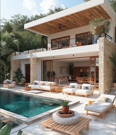 a house with a pool and lounge chairs around it