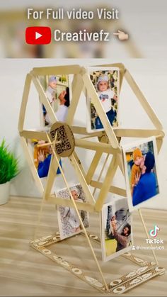 a wooden structure with pictures on it and the words for full video visit creativez