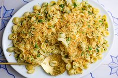 a white plate topped with macaroni and cheese