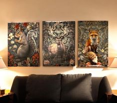 three paintings on the wall of a living room with a couch and lamp next to it