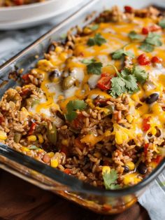 a casserole dish filled with mexican rice and beans