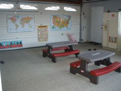 there are two benches in the room and one is red, gray, and black