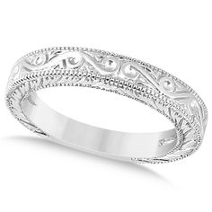 a wedding band with intricate designs on it