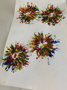 two pieces of paper with paint splattered on them