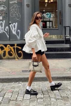 How to style a poplin shirt:  • shorts + loafers   • jean + basket bag  • cargo trousers + clogs London Summer Outfits 2023, London Street Style Summer 2024, Spring Transition Outfits 2024, Spring Street Style 2024, Chilly Beach Day Outfit, Feminine Spring Outfits, Summer Outfits Nyc, Museum Date Outfit, Spring Transition Outfits