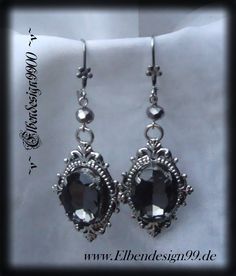 A very elegant pair of Gothic-style earrings that, like all my pieces of jewelry, were made with great care and attention to detail. The earrings were made from silver-plated brass ornaments with hematite-colored glass beads and black diamond rhinestones. The hangers, including the brisures, are approx. 6.5 cm long. Gothic Pierced Jewelry For Wedding, Handmade Gothic Wedding Earrings, Gothic Dangle Earrings For Wedding, Victorian Silver Chandelier Earrings, Gothic Drop Earrings For Formal Occasions, Handmade Silver Victorian Chandelier Earrings, Handmade Victorian Silver Chandelier Earrings, Gothic Formal Earrings For Pierced Ears, Silver Gothic Earrings For Formal Occasions