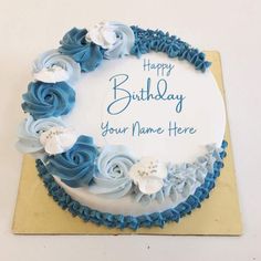 a birthday cake with blue frosting and white flowers on the top that says happy birthday your name here