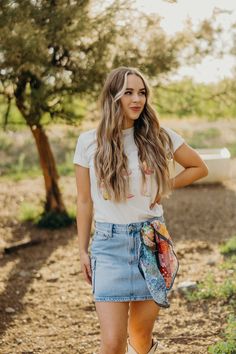 The Wiley Skirt is a vintage-inspired, cowgirl denim mini skirt. With a light wash and cargo pockets, this mini length skirt combines practicality and style. Perfect for a day out in the sun. Front center length: 14 1/2" Side length: 15" Courtney is wearing size small paired with The Cowgirly Boots Tee and Ariat Casanova Boots Curvy Dress, Heritage Collection, Denim Mini, Denim Mini Skirt, Bottoms Pants, Clothes For Sale, Sweater Top, Jumpsuit Romper, Mini Skirt