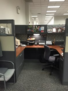 an office cubicle with desks and chairs