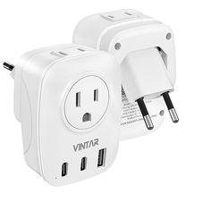 two white wall plugs are shown side by side with the same charger attached