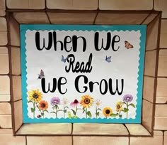 a sign that says, when we read we grow with sunflowers and butterflies