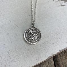 "This wax seal letter pendant is made of fine silver (99.9% pure silver) so that your custom silver initial jewelry is a great gift for a birthday present or Christmas gift and for yourself, too! Each pendant is handmade in a multiple step process until it becomes a pendant that resembles the old fashioned wax seals found on vintage envelopes. Every pendant will be unique and have its very own \"personality\". I believe in perfect imperfections, so the way it comes out of the batch is how it is Sterling Silver Initial Pendant With Engraving Option, Sterling Silver Engraved Initial Pendant Necklace, Silver Hand Stamped Initial Pendant Necklace, Engraved Sterling Silver Initial Pendant Charm, Sterling Silver Initial Pendant Necklace, Hallmarked, Wax Seal Pendant, Silver Initial Necklace, Monogram Jewelry, Precious Metal Clay