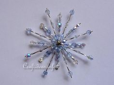 a snowflake made out of crystal beads