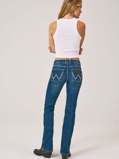 A BOOTCUT BRIMMING WITH RETRO VIBES Mae places a contemporary twist on our cowgirl cool aesthetic. All Wrangler® jeans for women are designed to accentuate your best assets, but our women's Retro® jeans go above and beyond. Wrangler® Retro® jeans pay tribute to our Western heritage with the iconic details you know and love, including the leather patch and authentic W stitching on the back pockets. Plus, these women's bootcut jeans come with a figure-flattering, mid-rise fit that's truly versatile. With a variety of washes to choose from, you can easily make this throwback jean an everyday staple. Fitted High Rise Western Flare Jeans, Western High Rise Fitted Flare Jeans, Western Style Fitted High Rise Flare Jeans, Fitted Medium Wash Flare Jeans For Rodeo, Fitted Jeans With Five Pockets For Ranch, Western Fitted Flare Jeans For Rodeo, Fitted Straight Leg Jeans For Ranch, Fitted Western Jeans For Rodeo, Western Fitted Jeans For Rodeo