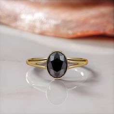 A truly amazing solitaire bezel ring set with genuine earth mined 3.07 carat black oval shaped diamond, perfect alternative engagement ring. 🖤Setting Total Carat Weight: 3.07 Carats 14K Yellow Gold Certificate Of Authenticity Included 🖤Main Diamond: Shape: Oval Weight: 3.07 Carats Color: Fancy Black Clarity: Opaque Color Origin: Enhanced Color Distribution: Even Grade: AAA Measurements: mm Stock ID: Notes: 🖤All diamonds are natural, earth-mined diamonds that were suitable for Color Enhancemen Classic Black Oval Sapphire Ring, Classic Black Sapphire Oval Ring, Solitaire Bezel Engagement Ring, Diamond Oval Engagement Ring, Diamond Ring Rose Gold, Black Diamond Earrings Studs, Black Diamond Necklace, Black Diamond Studs, Black Diamond Jewelry