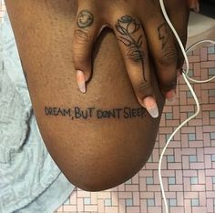 a woman with tattoos on her stomach and writing on the side of her body that says dream, but don't sleep