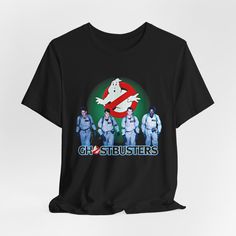 GHOSTBUSTERS Tshirt T-shirt T shirt Vintage Aesthetic Tee 1980s Shirt This classic unisex jersey short sleeve tee fits like a well-loved favorite. Soft cotton and quality print make users fall in love with it over and over again. These t-shirts have-ribbed knit collars to bolster shaping. The shoulders are tapered for a better fit over time. Dual side seams hold the garment's shape for longer.  .: Made with 100% Airlume combed and ring-spun cotton, a lightweight fabric (4.2 oz/yd² (142 g/m that Pop Culture Short Sleeve T-shirt With Logo, Unisex Short Sleeve Shirt For Fan Merchandise, Unisex Short Sleeve Fan Merchandise T-shirt, Fan Merchandise Short Sleeve T-shirt, Band Merch Shirt With Sublimation Print, Unisex Retro Short Sleeve T-shirt, 90s Style Short Sleeve Screen Print Shirt, 90s Style Screen Print Short Sleeve Shirt, 90s Crew Neck Shirt With Sublimation Print