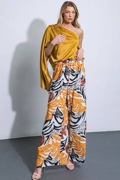 Printed Island Wide Leg Elastic Waist Woven Pant Indulge in spring chic with our Printed Island Wide Leg Elastic Waist Woven Pant. With a sophisticated and exclusive design, these pants are perfect for any occasion. The elastic waist ensures a comfortable fit, while the wide leg silhouette adds a touch of elegance. Embrace luxury and style with these must-have pants. Matching Island Breeze Kimono sold separately - elasticized waist and front tie - wide leg - medium weight fabric not see through Midi Pants, Island Breeze, The Wind, Medium Weight, Women Collection, Exclusive Designs, Dress Collection, Orange Black, Woven Fabric