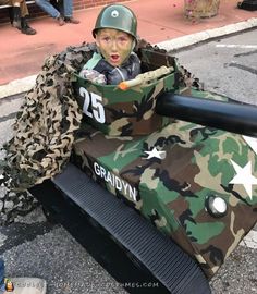 a child in a tank costume on the street