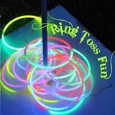 the glow ring toss game is lit up with neon colors and has rings on it