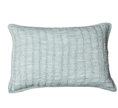 a light blue pillow on a white background