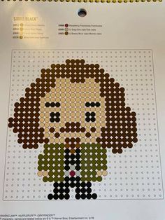 a cross stitch pattern with an image of a man in a suit and tie on it