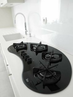 a black and white stove top in a kitchen