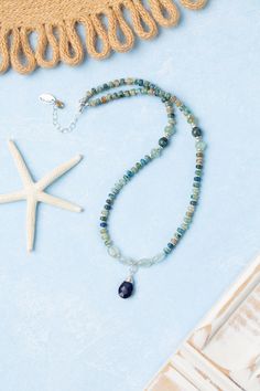 Indulge in the beauty of the sea with our Pacifica Collection! Each piece is meticulously handcrafted with stunning shades of blue, capturing the essence of ocean waves and clear skies. Sterling Silver (Lead & Nickel Free) Aquamarine, Jasper, Apatite, Lapis Lazuli 14.5-16.5" adjustable with sterling silver lobster claw clasp We hand select our natural materials, thus there may be slight variations in color and/or size that will not detract from the overall aesthetic. Our unique handcrafted designer jewelry for women is made in America, each design created individually in our personal design studio in Floyd, VA USA Blue Kyanite Gemstone Bead Necklaces, Blue Kyanite Gemstone Beaded Necklace, Blue Gemstone Beads Jewelry For Beach, Blue Kyanite Gemstone Beads Jewelry, Blue Kyanite Jewelry With Gemstone Beads, Blue Kyanite Gemstone Necklace, Artisan Blue Jewelry For Beach, Artisan Blue Jewelry For The Beach, Adjustable Blue Ocean-inspired Necklace